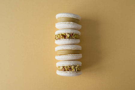 Baking macaroons on a yellow backgroundの写真素材