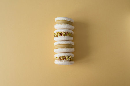 Baking macaroons on a yellow backgroundの写真素材
