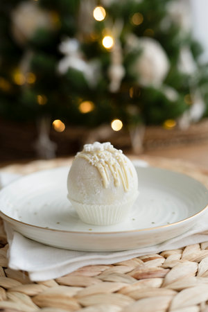 Chocolate bomb for a milk drink on a plateの写真素材