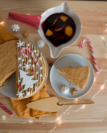 Christmas pastries in a cup on a wooden tableの写真素材