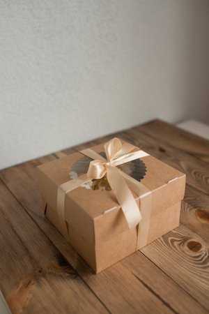 Kraft pastry box decorated with ribbonの写真素材