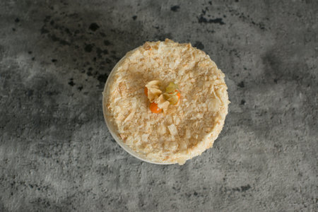 Layered cake on a plate decorated with physalisの写真素材