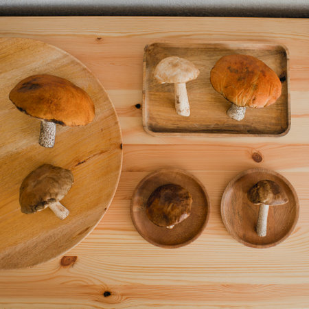 Mushrooms are lying on a wooden tableの写真素材
