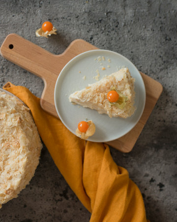 Layered cake on a plate decorated with physalisの写真素材