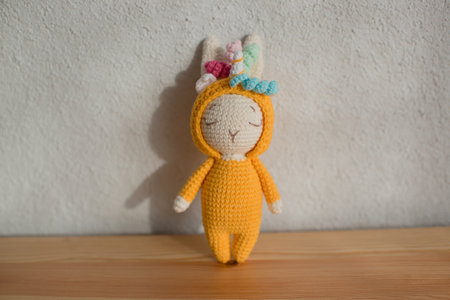 Children's toy cute white rabbit in a unicorn costume, handmade, hobby.の写真素材