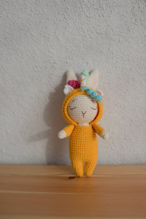 Children's toy cute white rabbit in a unicorn costume, handmade, hobby.の写真素材