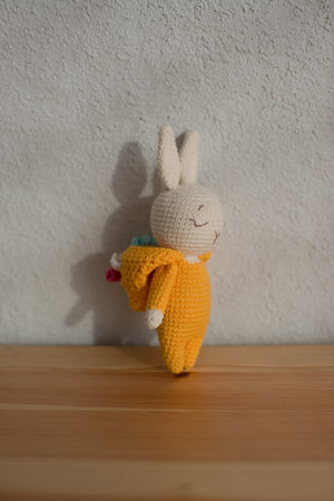Children's toy cute white rabbit in a unicorn costume, handmade, hobby.の写真素材