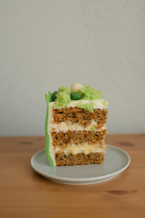 a piece of cake on a wooden stand, baking for a children's holidayの写真素材