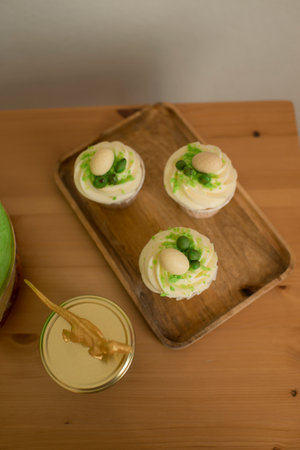 Cupcakes decorated with candy in the form of dinosaur eggsの写真素材