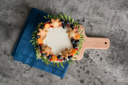 Homemade cake with berries and cookies on table, top view