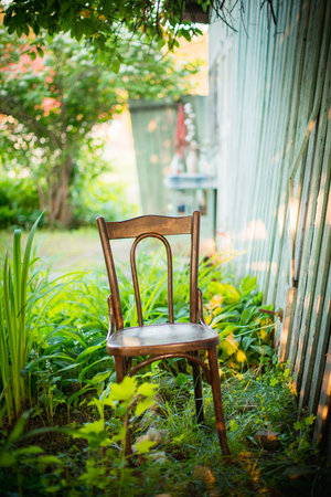Wood chair in the garden - vintage filter effect and selective focus pointの写真素材