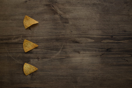 Nacho chips on wooden background. top view. Space for textの写真素材