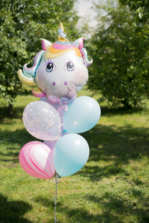 Unicorn balloons in the park. colorful unicorn partyの写真素材