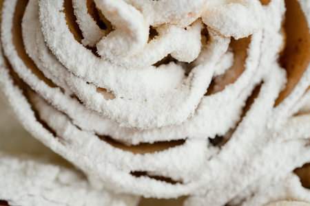 Close-up of sweet pastries sprinkled with powdered sugar