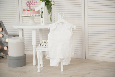 Child dress on a hanger in the interior of the roomの写真素材