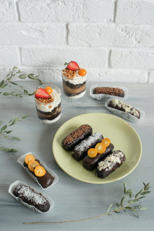 Delicious chocolate cakes with cream on plate