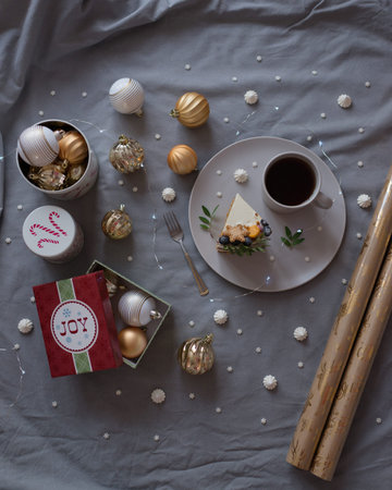 Christmas table setting with a cup of coffee, cookies and Christmas decorationsの写真素材