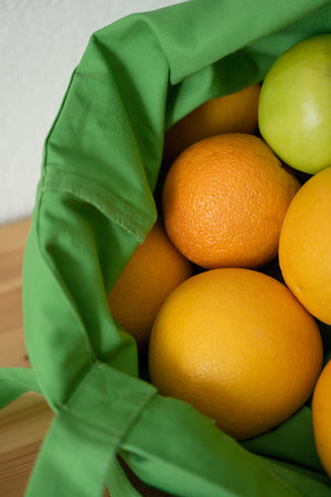 Fresh fruit oranges are in the reusable bag. Eco-friendly product. concern for the environment. food delivery.の写真素材