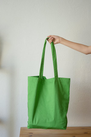 Reusable bag in the hand of an unrecognizable girlの写真素材