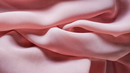 Pink silk background. The texture of the pink polycotton fabric is smooth and soft with beautiful...