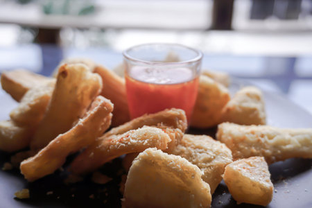 A delicious snack of boiled sweet potato and sambal.