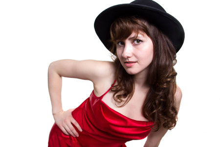 Girl in a red dress and in a black hat