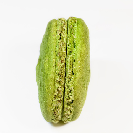 colorful macaroon pistachio cookies on white backgroundの写真素材