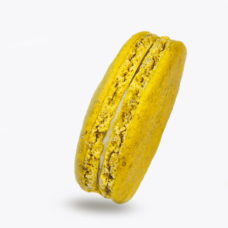 colorful macaroon cookies yellow on white backgroundの写真素材
