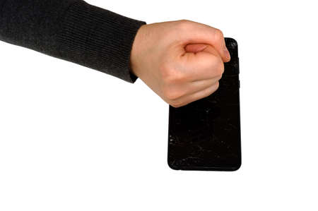 broken, punch, fist hand breaks phone smartphone on white backgroundの写真素材