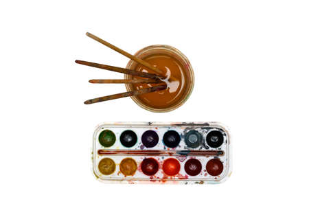watercolor paint round, glass of water with brushes white background artist artの写真素材