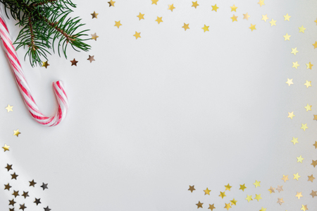 Magic Christmas card with shining stars and cones in a glass jar and caramel. Flat lay, top viewの写真素材