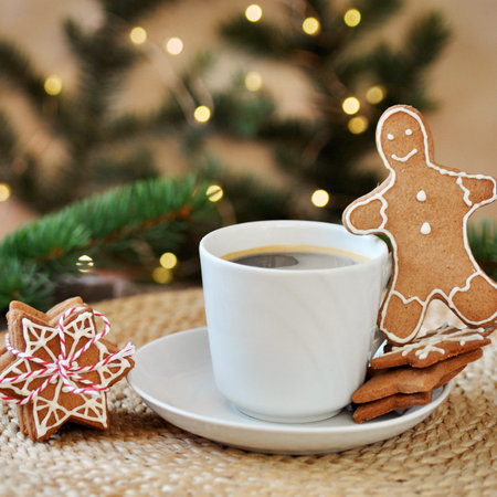 Traditional homemade Christmas gingerbread sugar frosting shaped like a funny little man and a Cup...