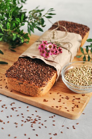 Useful home-made vegan sourdough bread from green buckwheat with flax and sunflower seeds. Raw healthy and proper nutrition.の写真素材