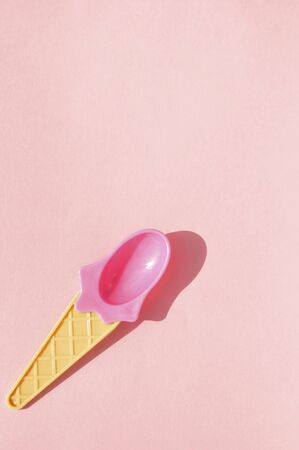 Summer pink ice cream spoon on pink background.の写真素材