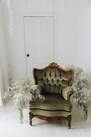 antique green royal chair in a modern interiorの写真素材