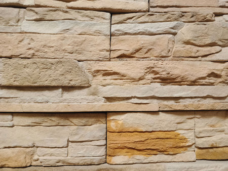Close-up texture of natural natural stone laid on the wall...