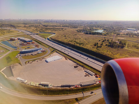 Panorama of the earth at sunset from the porthole of an aeroplane...の写真素材