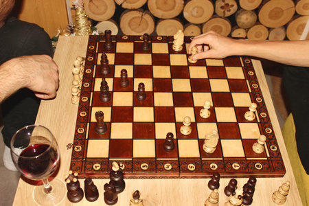 Wooden chess on the background of the fireplace, which is played on New Years Eve