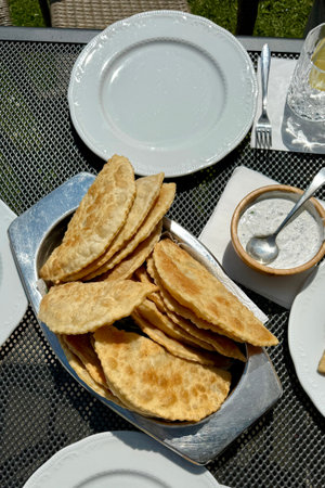 At the picnic, delicious hot chebureks with meat are prepared for tasting