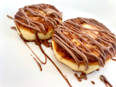 Two cheesecakes for breakfast on a white plateの写真素材