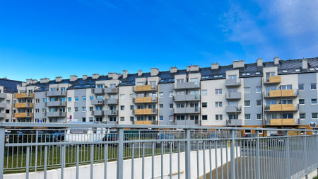 The facade of a new high-rise building in the city on the background of the skyの写真素材