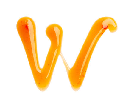 Chili sauce alphabet Letter W isolated on a white background. Close up, top view.の写真素材