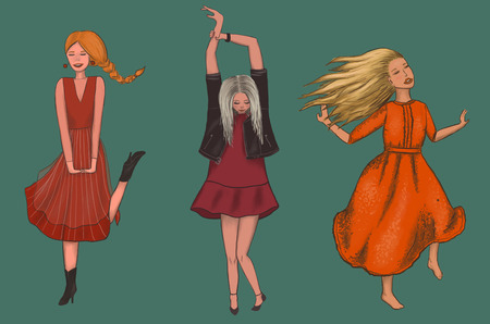 three girls in red dresses are dancingの写真素材