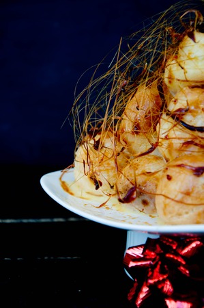 Profiterole, cream puff - French dessert choux pastry ball filled with whipped creamの写真素材