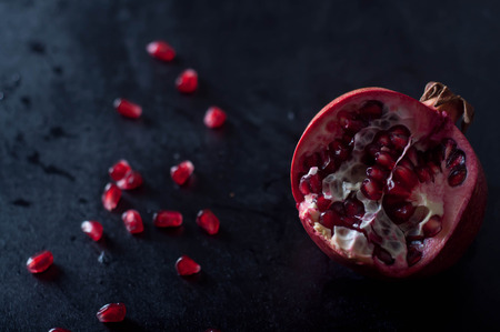 Pomegranate fruits on wooden table background, natureの写真素材