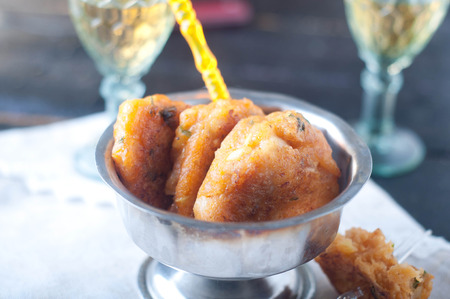 Fish fingers and fishcake burgers on a plateの写真素材