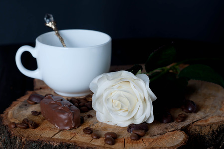Cappuccino coffee cup and white roses , tulipの写真素材
