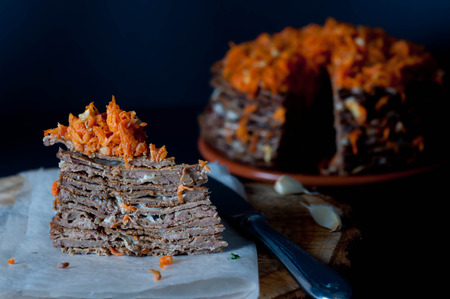 Pancake Pie from the Liver with Walnuts  on Wooden Tableの写真素材