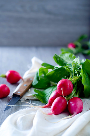 Delicious Fresh radishes from the garden on wooden backgroundの写真素材