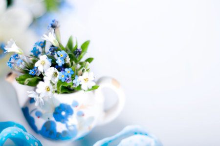 Books and wildflowers on napkin on wooden table on wooden wall backgroundの写真素材
